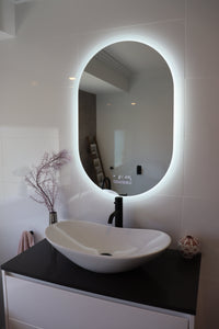  Oval Smart LED mirror illuminates the bathroom in the absence of main lights