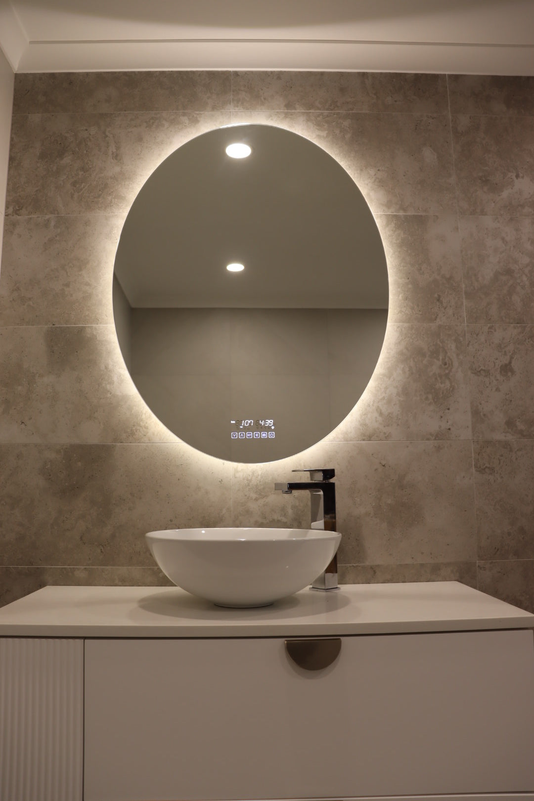 Inviting Bathroom Vanity Space with Warm White Light from Smart LED Mirror on Greyish Brown Wall