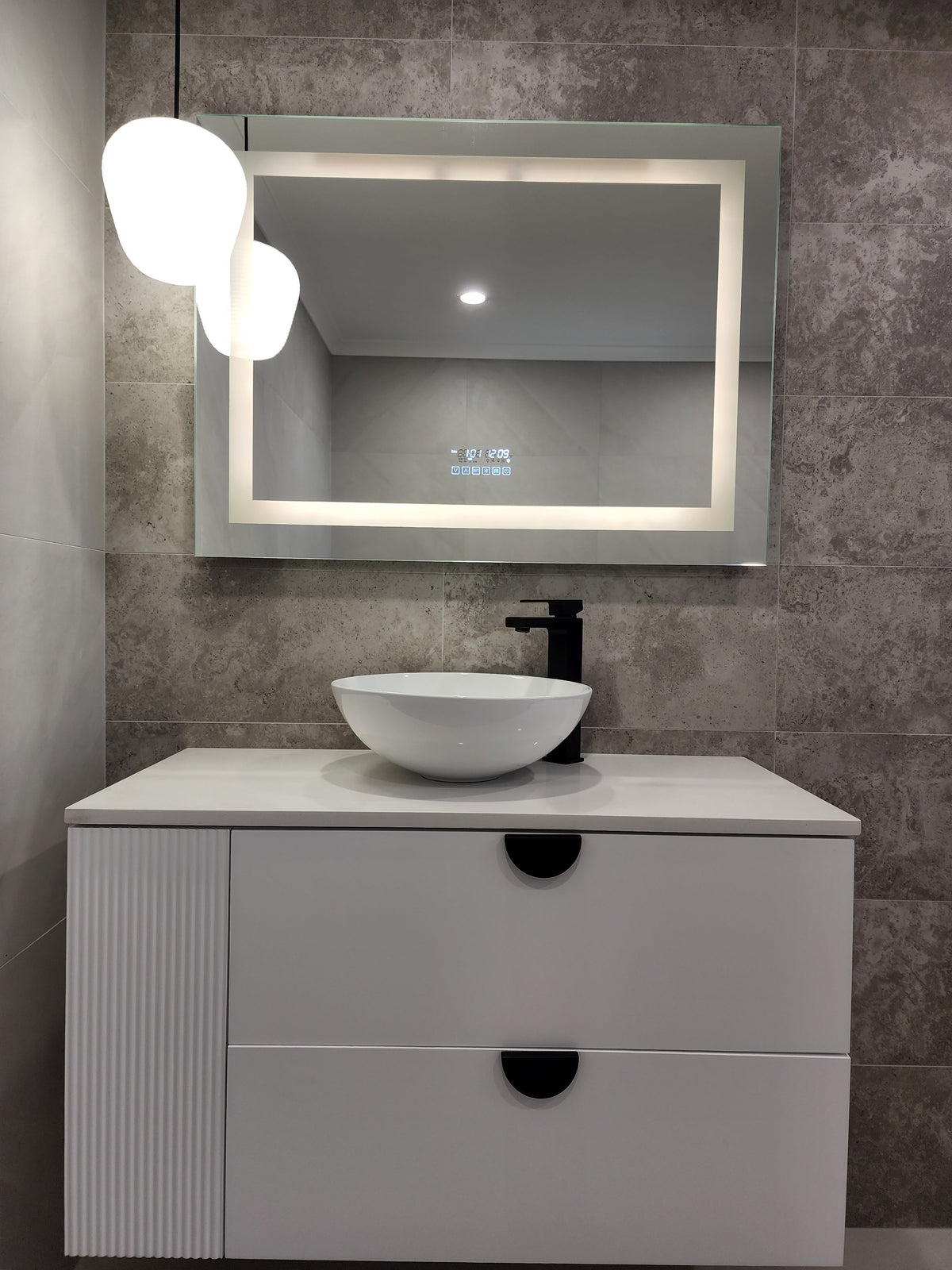 Frontal Shot of Vanity Area in Dirty Grey Bathroom with Front-Lighted LED Mirror, and Cabinet