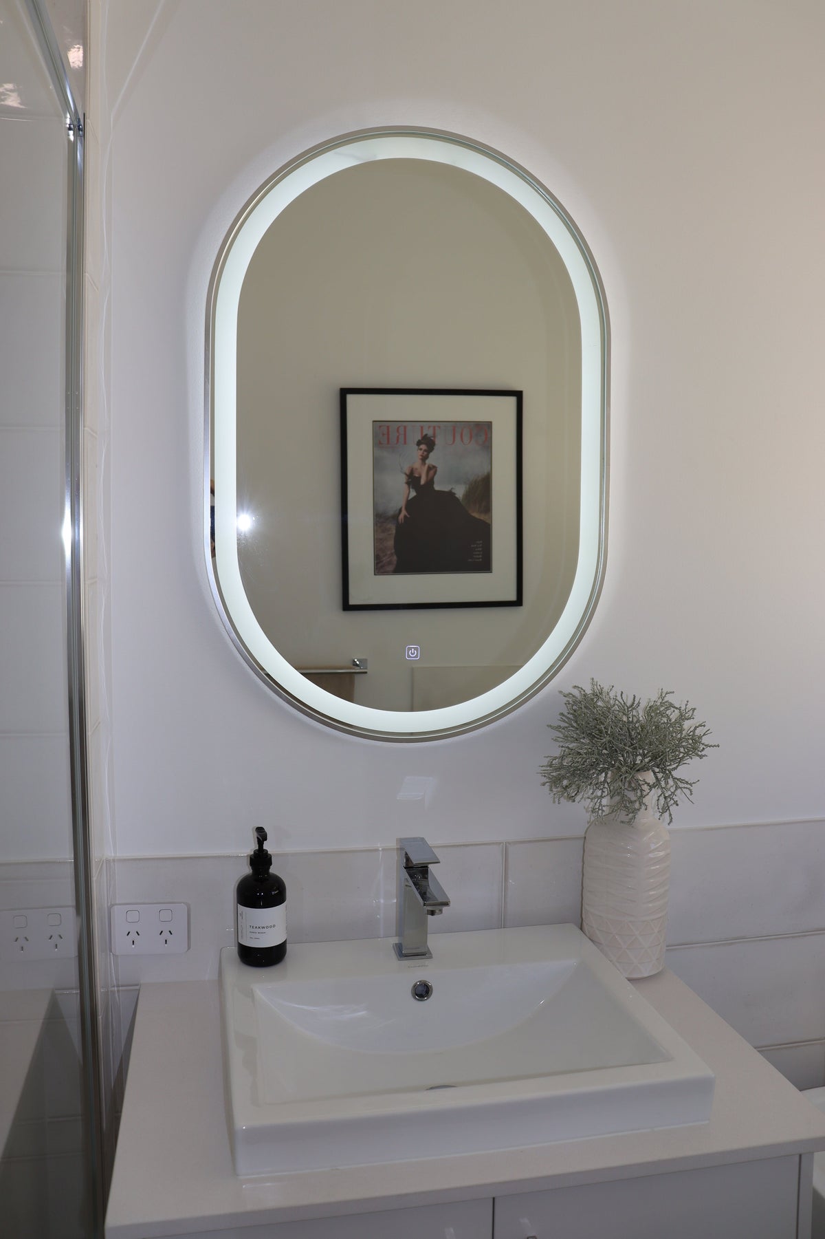  Oval LED Mirror and Spotless White Square Sink in White Bathroom