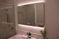 Ambient Lighting of InVogue Large Smart Backlit LED Mirror in a White Bathroom