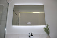 Scenic View from Below of InVogue Large Backlit LED Mirror on White Wall