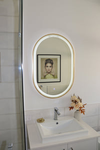 Sleek Silver Frame LED Vanity Mirror Capturing Opposite Wall's Artwork