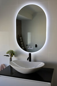 Black Countertop in Modern Luxe Washroom with Riviera LED Smart Mirror