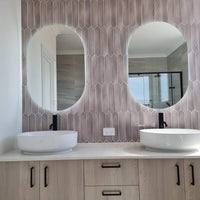 Patterned Washroom Wall with Dual Oval and Pill-shaped Digital Mirrors